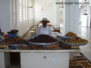 Photo: A trader selling dates and other fruits